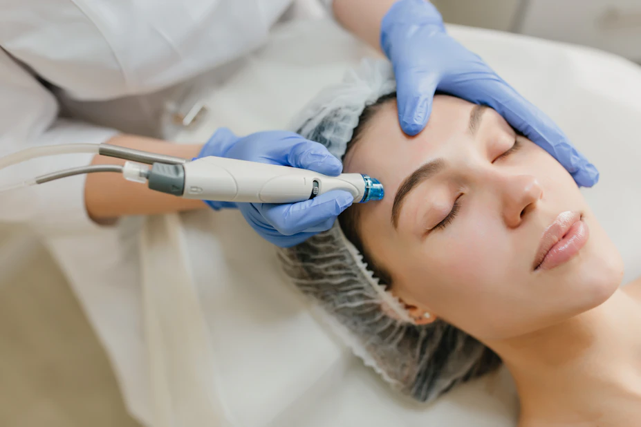 Clinician performing a resurfacing facial treatment