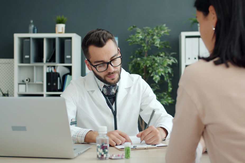 Surgeon consulting with a patient
